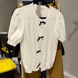 Elegant White Cardigan with Black Bow Accents